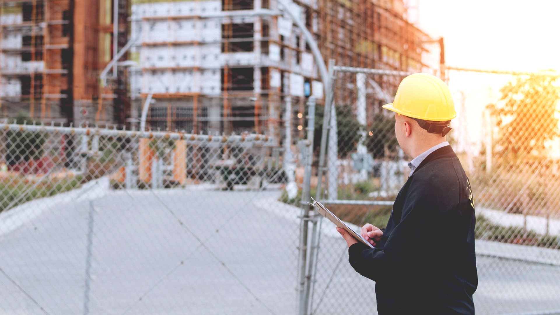 Building inspector looking at a building under construction